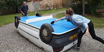 An old car converted into a ping pong table