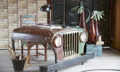 Hood of an old jeep converted into a desk