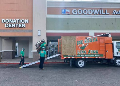 College HUNKS delivering donations for Goodwill