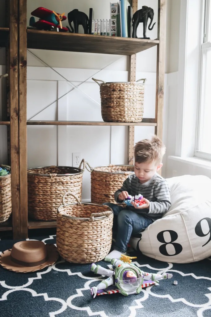 Stylized storage baskets in a family space ready for settling in with toddlers.