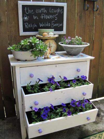 A dresser converted into a stacked garden