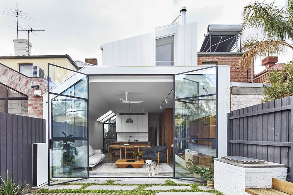 glass doors opening to an indoor/outdoor living space