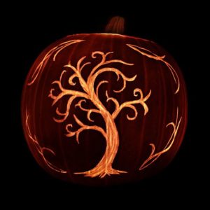Artistic tree carving on a pumpkin