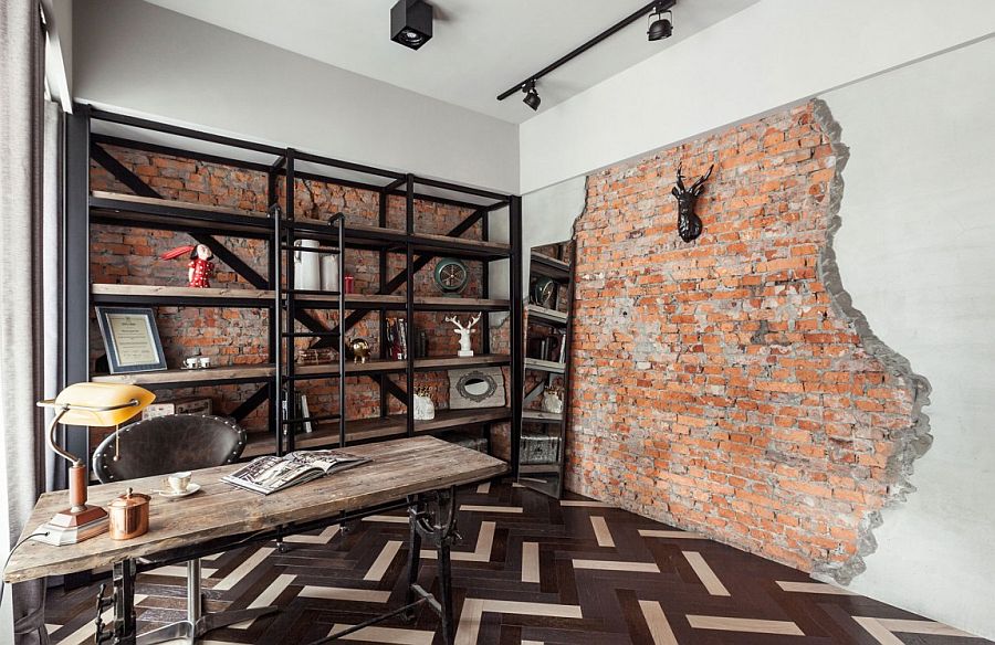 Wood desk among metal shelving units to utilize mixed materials in this industrial design themed home