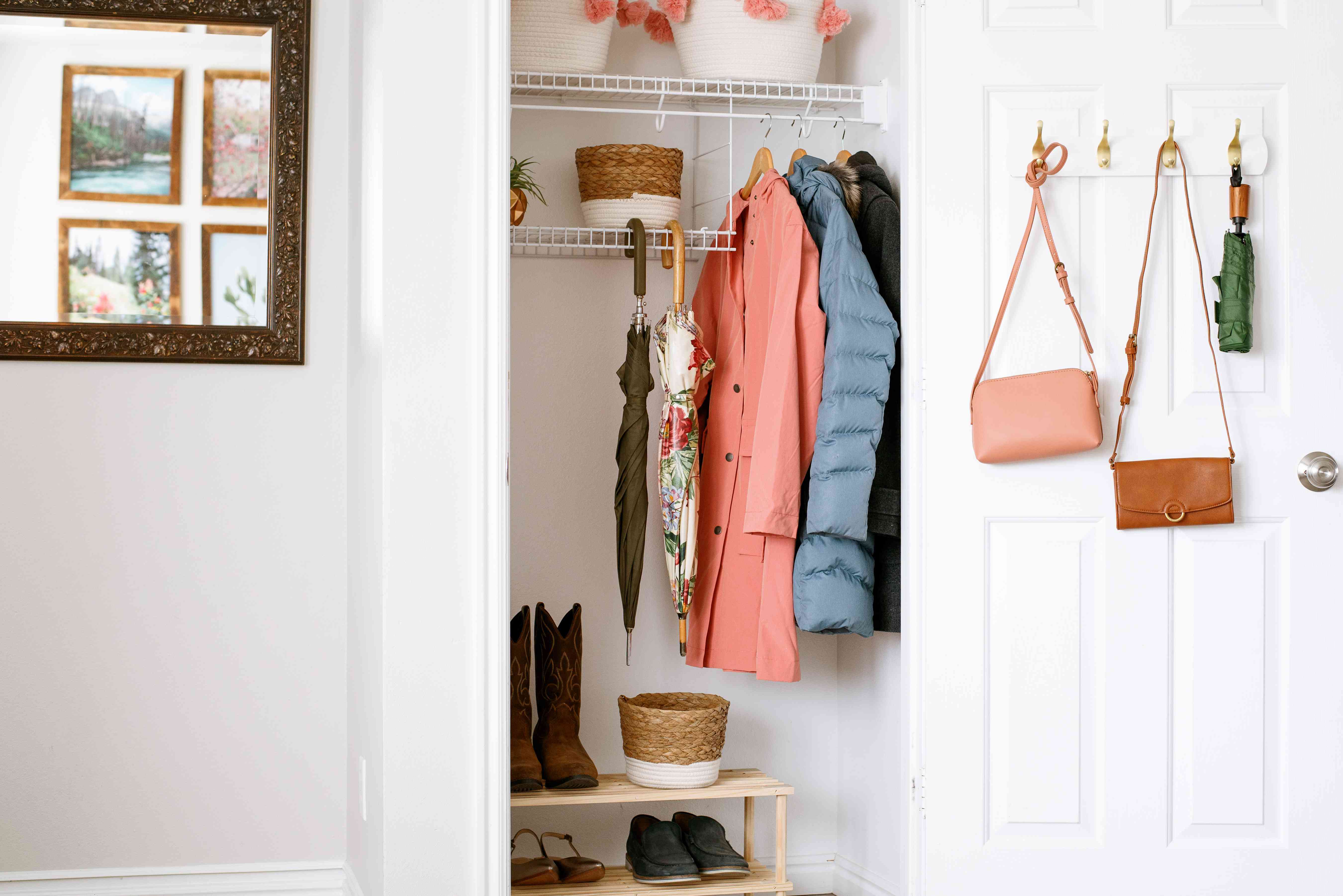 Organized closet with winter coats hanging and shoes neatly arranged