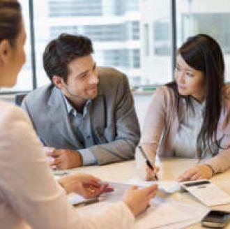 Completing paperwork in the office on closing day