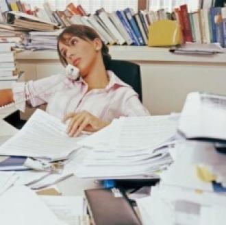 A messy desk and office