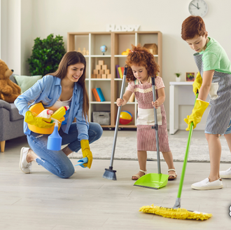 A young family cleaning together—captures the spirit of building cleaning routines as a team.