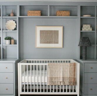 clear crib and built-in shelves for an organized and clutter-free baby room