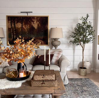 Cozy fall living room with warm tones and autumn décor