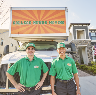 Two College Hunks haulers outside a moving truck