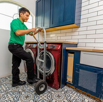 College Hunks mover taking out a washing machine