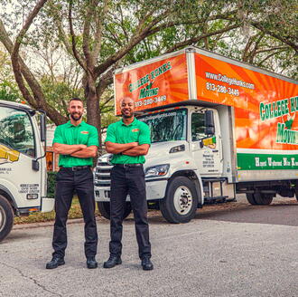 Two College Hunks Movers outside a truck