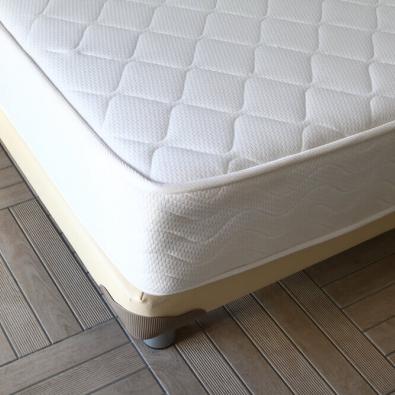 old-mattress-on-bed