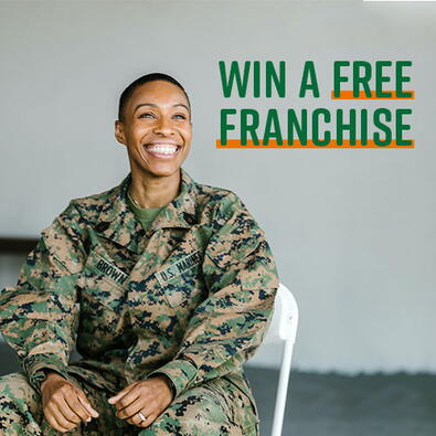 smiling veteran excited to win a free college hunks hauling junk and moving franchise