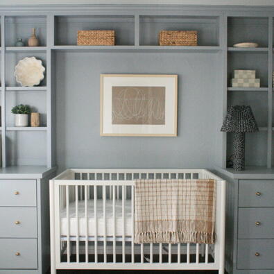 clear crib and built-in shelves for an organized and clutter-free baby room