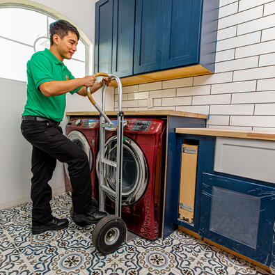 College Hunks mover taking out a washing machine