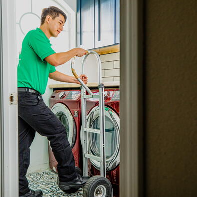 College Hunks mover taking out a washing machine