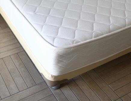 old-mattress-on-bed