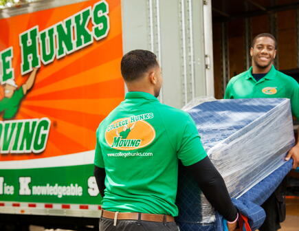 College HUNKS movers working 