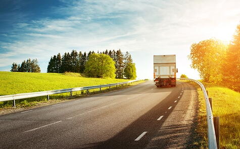 Cross-country moving truck traveling on a highway during a long distance relocation