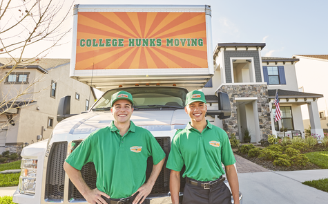 Two College Hunks haulers outside a moving truck