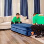 Two College HUNKS movers lifting furniture from the ground