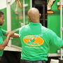 Two College Hunks movers closing a moving truck. 