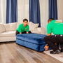Two College Hunks employees staging a home