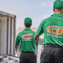 College Hunks movers walking towards a moving truck